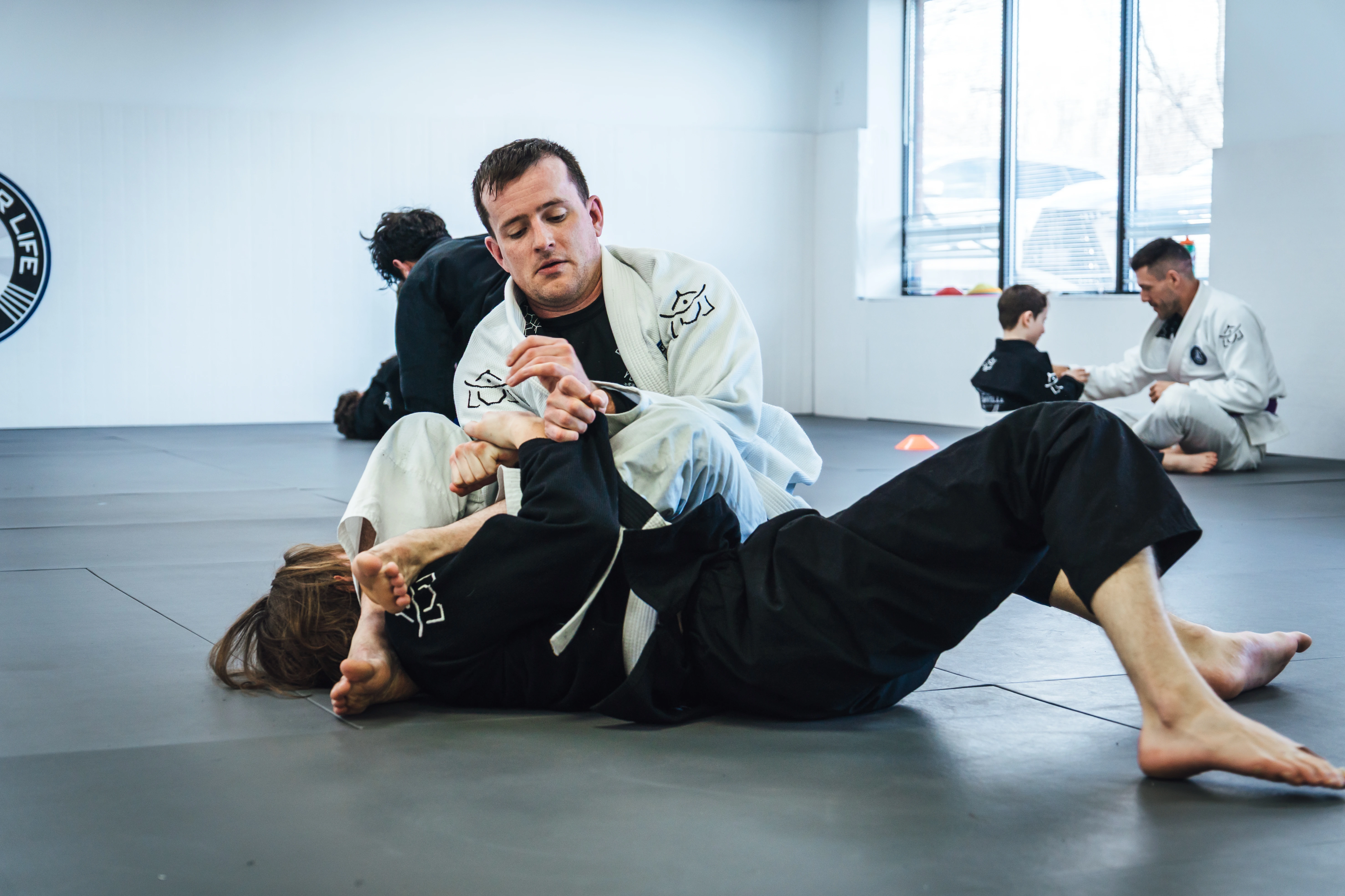 Instructor demonstrating an armbar technique